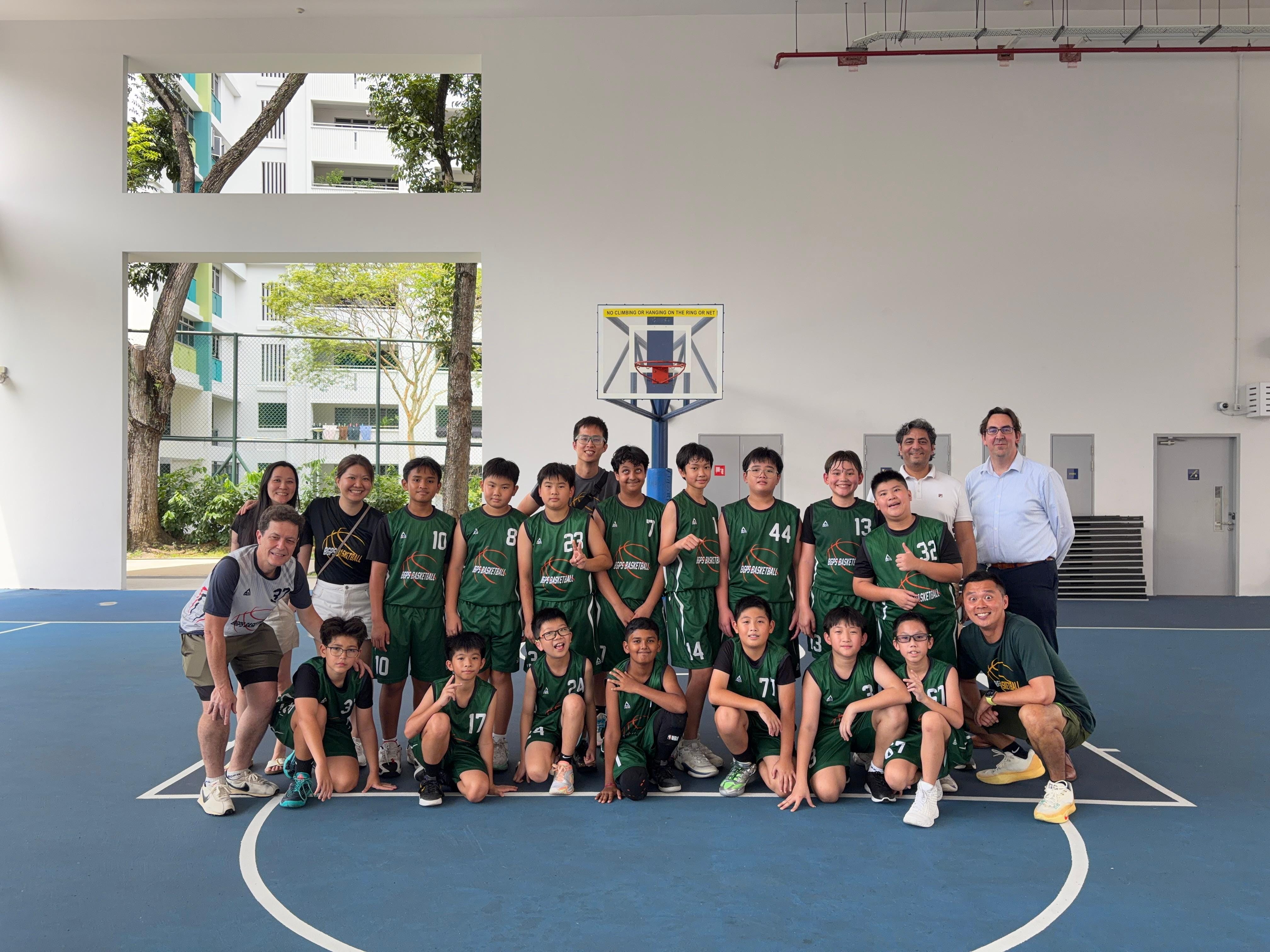 Students posing with basketballs
